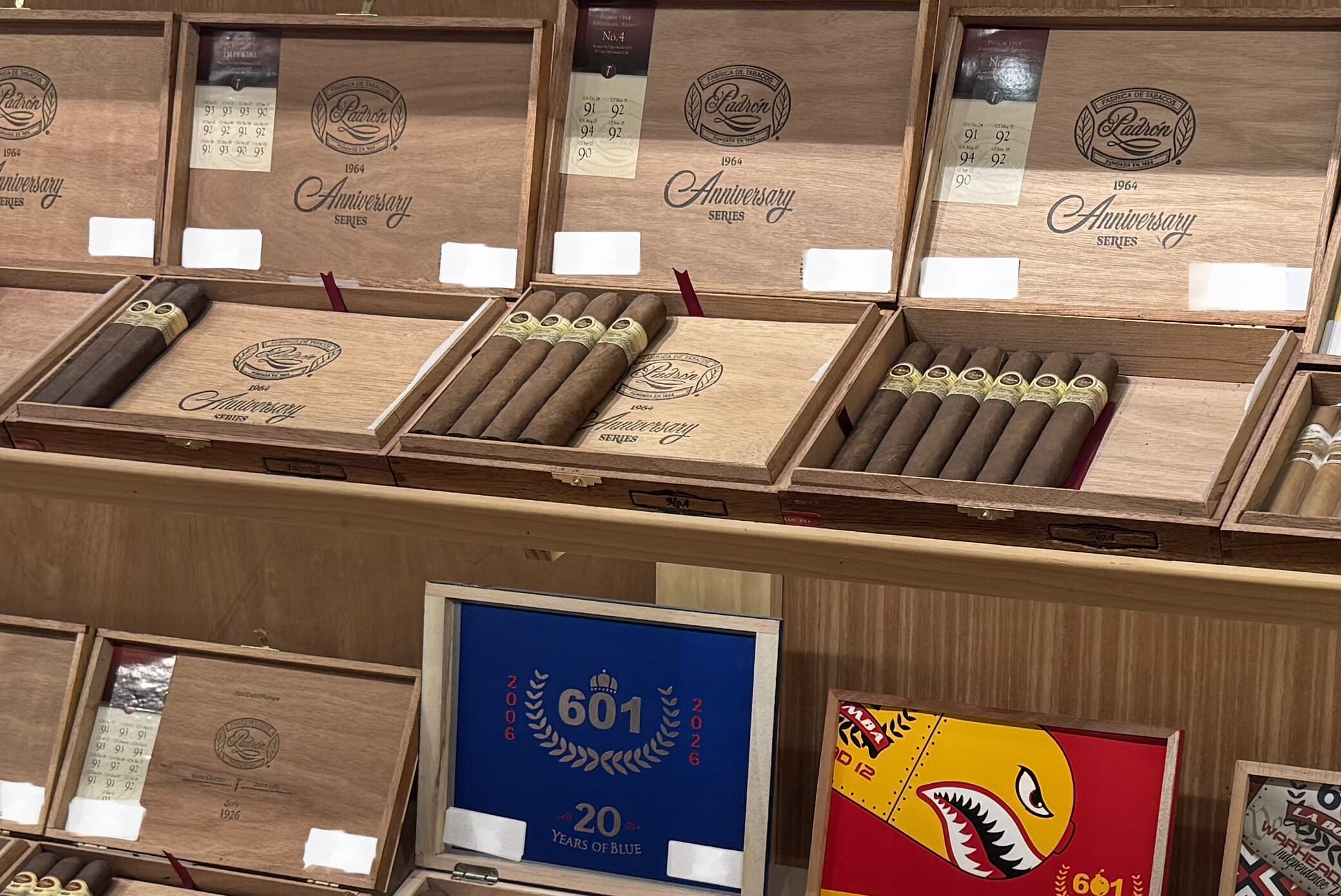 A wall of open Padrón 1964 Anniversary Series and 1926 Serie boxes in the Big Chief humidor