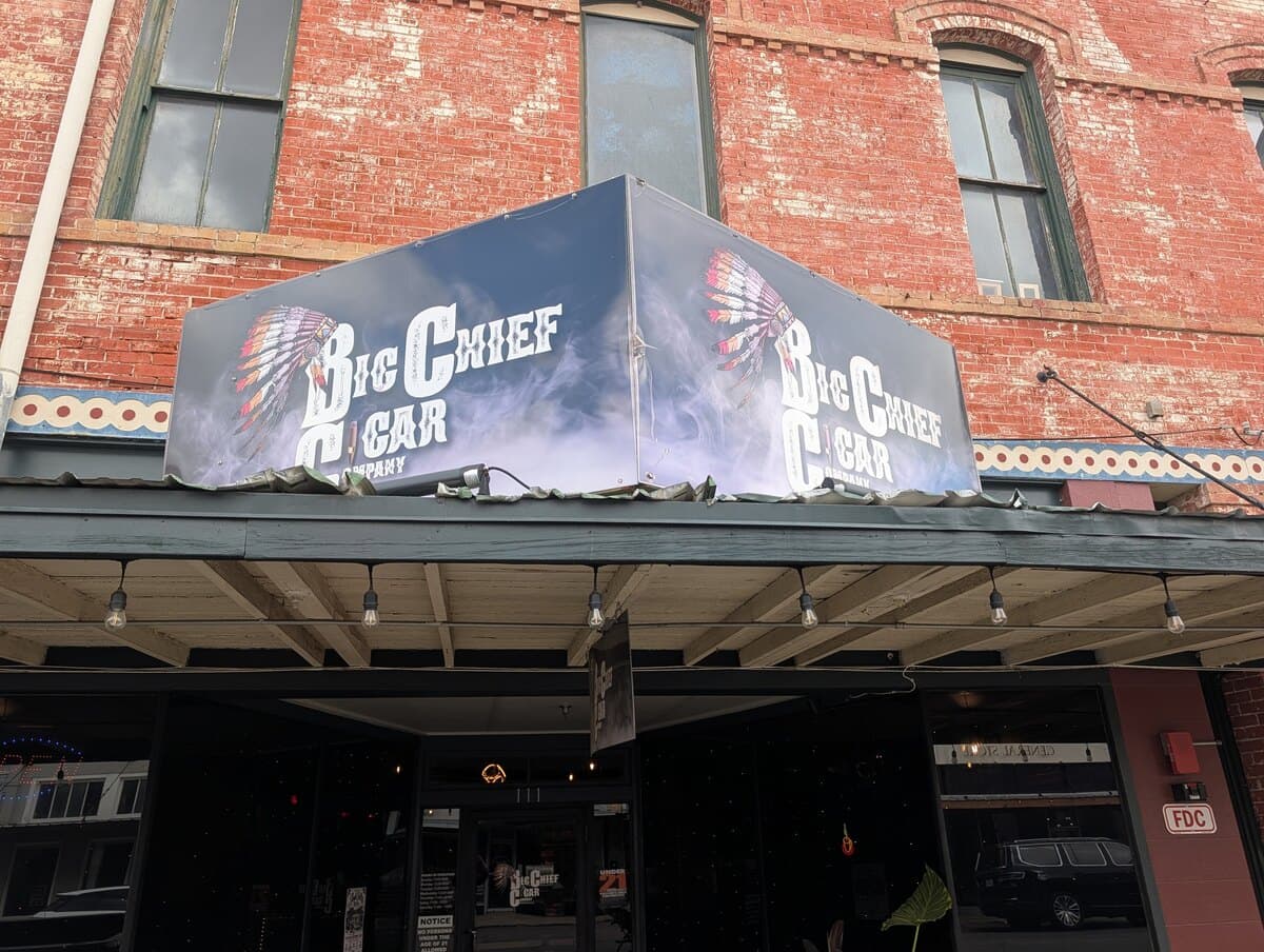 The Big Chief Cigar Company awning over the front door on North Austin Street